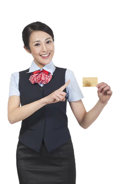 棚拍年轻女服务员展示银行卡图片