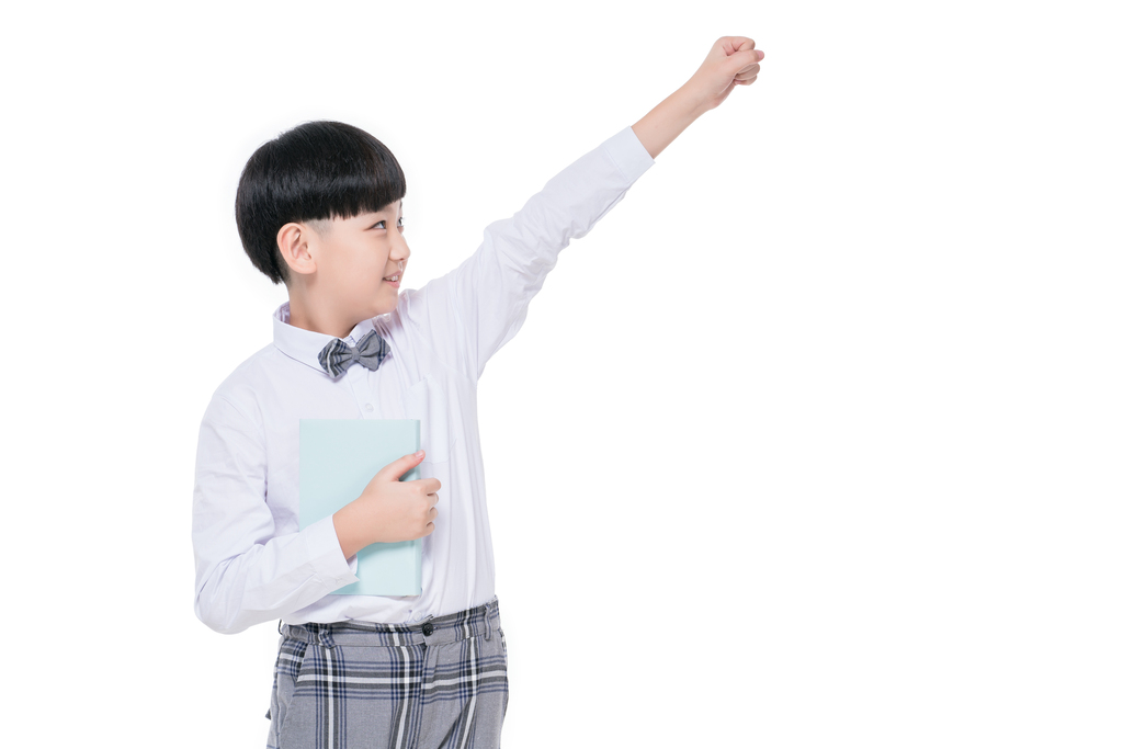 快乐的小学生手拿课本图片