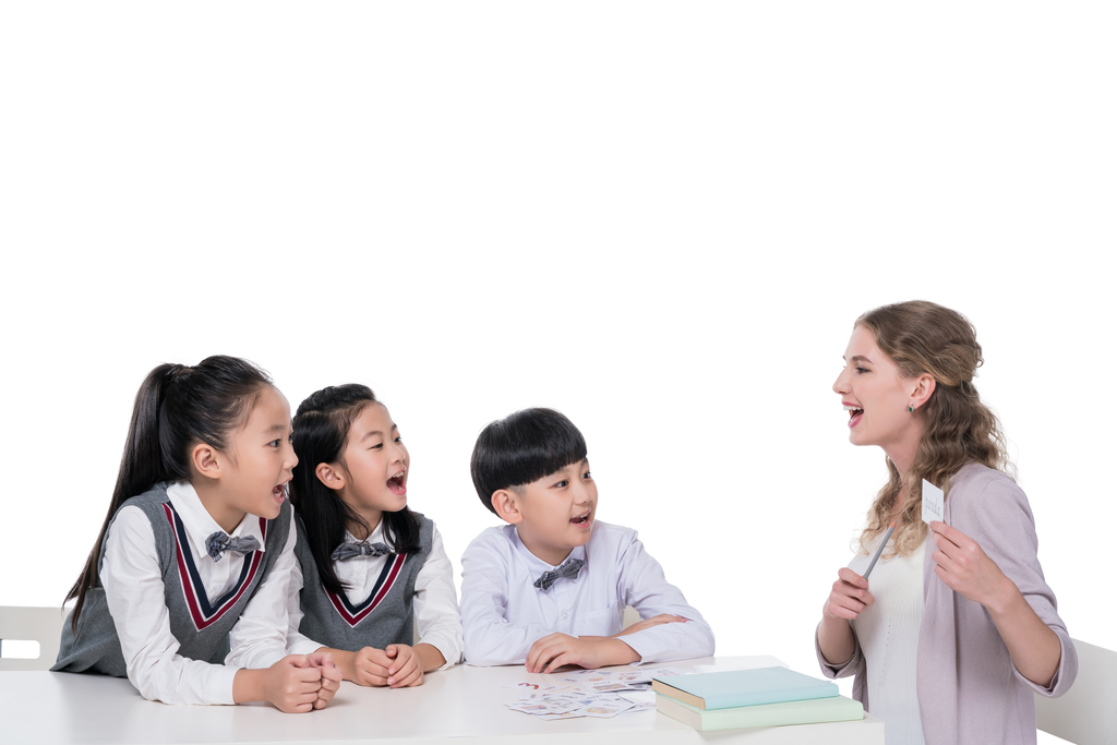 女外教指导小学生学习图片