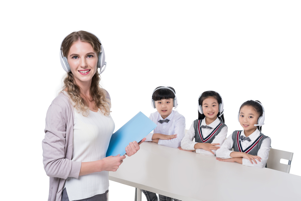 女外教指导小学生学习图片